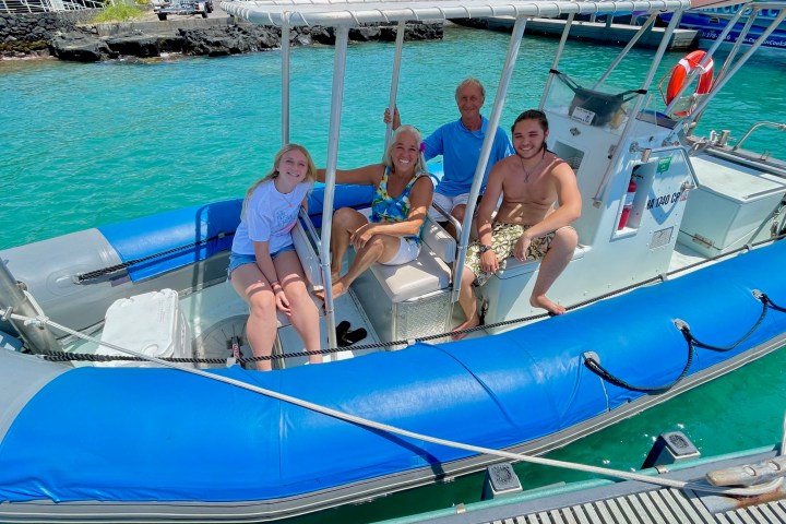 a group of people on a boat in the water