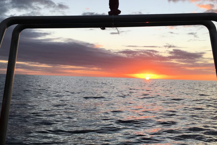 a sunset over a body of water